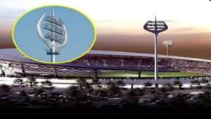Trishul-shaped floodlights glowing at the new Kashi Cricket Stadium during sunset.