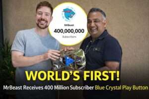 MrBeast holding the world's first 400 million subscriber Blue Crystal Play Button awarded by YouTube