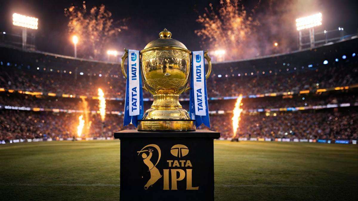 Golden IPL trophy displayed at M. Chinnaswamy Stadium in Bengaluru during IPL 2026 final with fireworks and packed crowd in background.