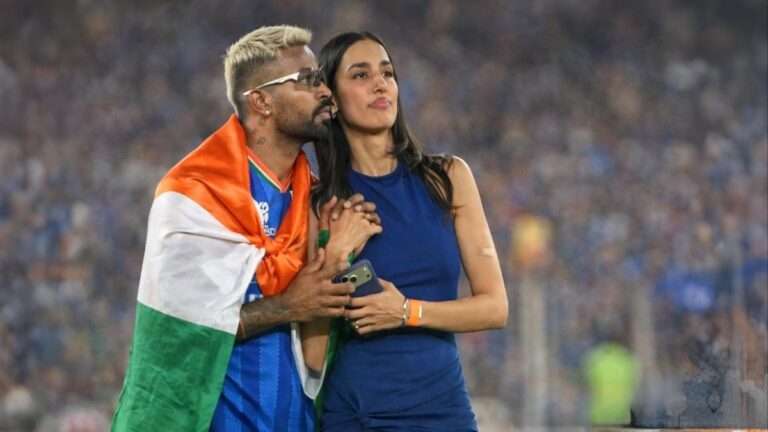 Indian cricketer Hardik Pandya celebrating with the Indian national flag during a stadium celebration, which later sparked a controversy regarding the Flag Code of India.