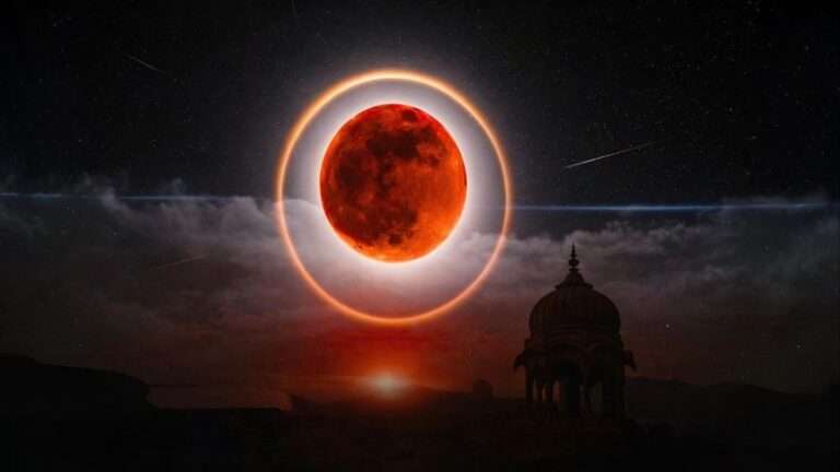 Deep red Blood Moon during total lunar eclipse glowing in night sky above temple silhouette RAAD WORLD astronomy feature image