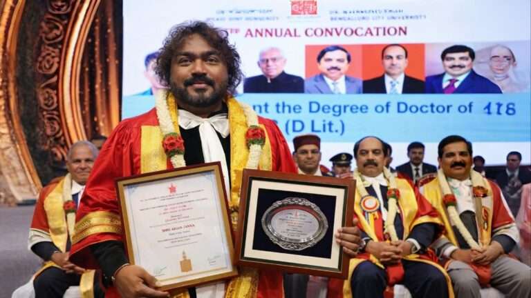 Arjun Janya receiving honorary doctorate at Bengaluru City University convocation ceremony holding certificate and plaque