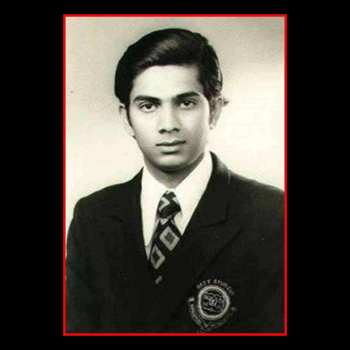Black-and-white portrait of young Dr. Shrikant Jichkar in a formal school uniform, highlighting his early academic journey and dedication to education.