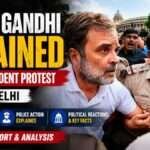 Rahul Gandhi being escorted by Delhi Police during a Congress-led student protest in New Delhi, with supporters and media gathered around the scene.